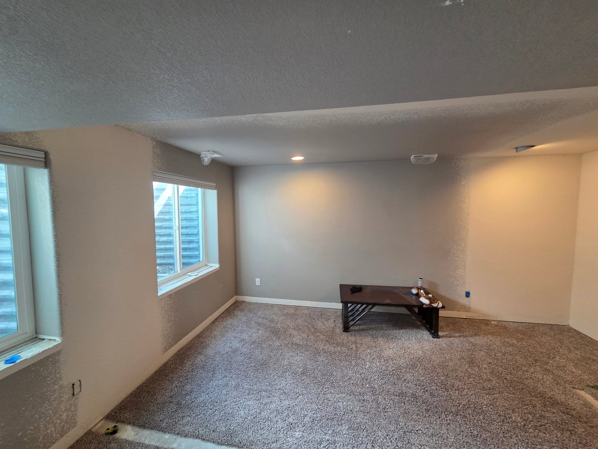 Completed carpeted room with new construction